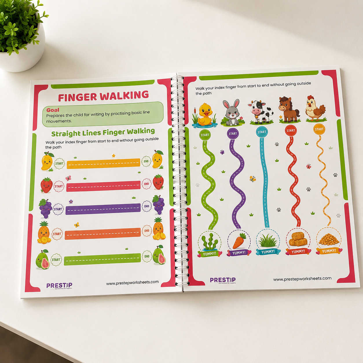 Open educational book with finger walking activities on a white surface